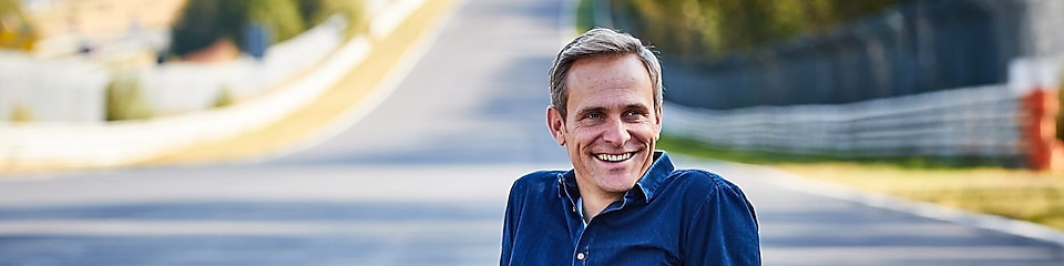 Man Sitting on Road and smiling